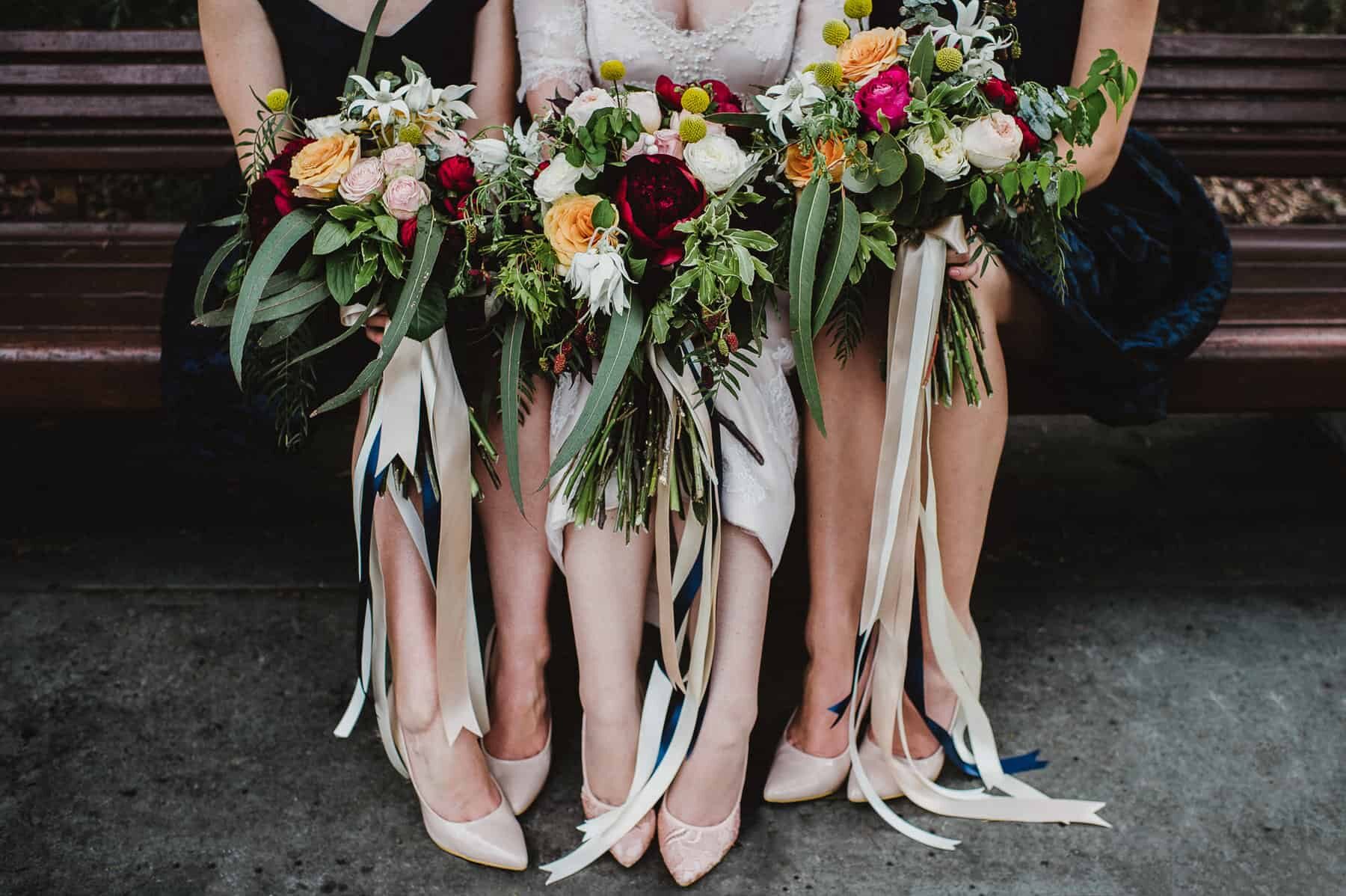 vibrant bridesmaid bouquets with silk ribbons