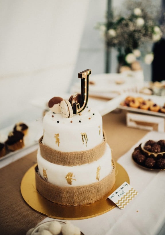 Simple wedding cake with gold leaf | Photography by Fiona Vail