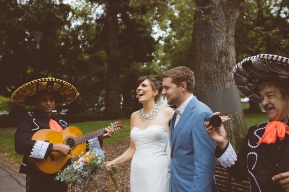 Newlyweds serenaded by a mariachi band