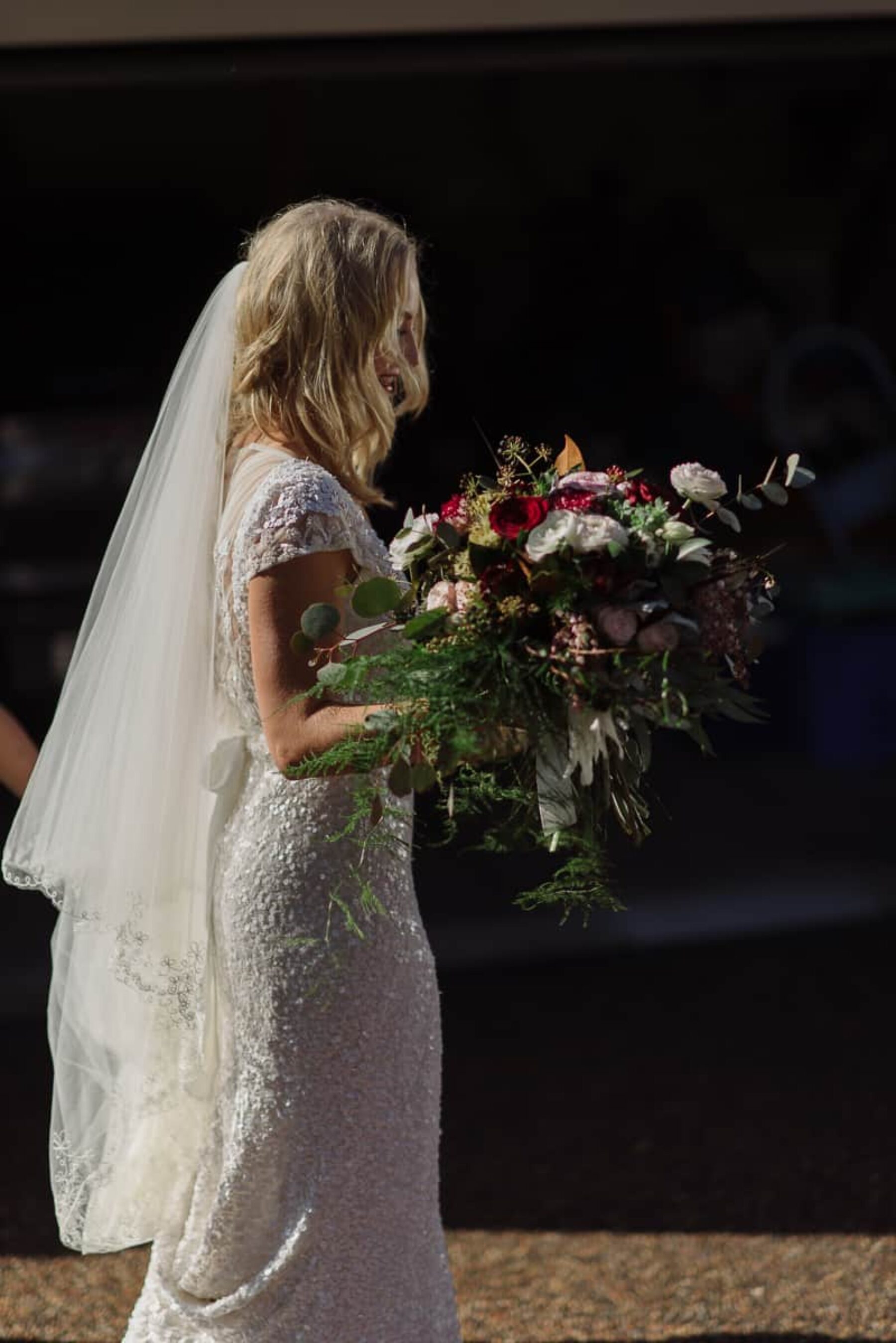 Karen Willis Holmes wedding dress / autumnal burgundy bouquet