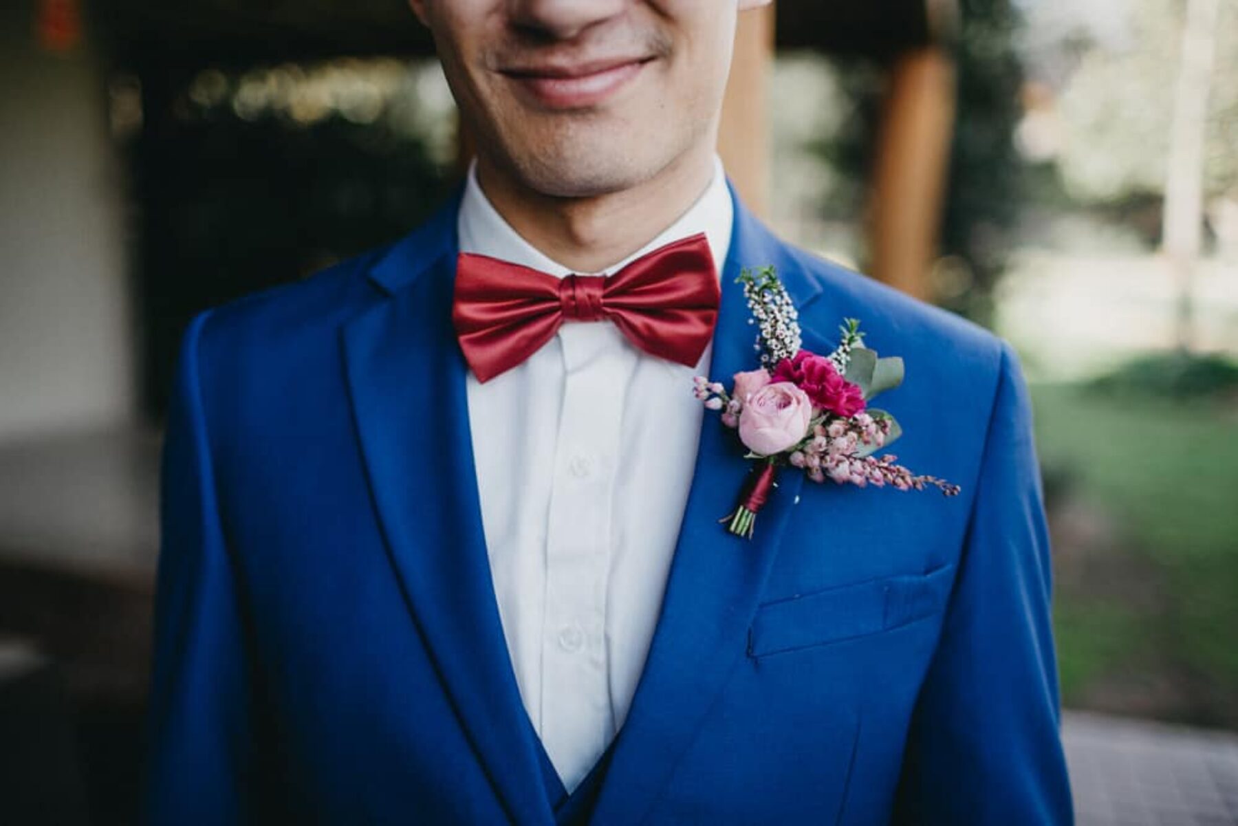 Cobalt blue suit and red bow tie