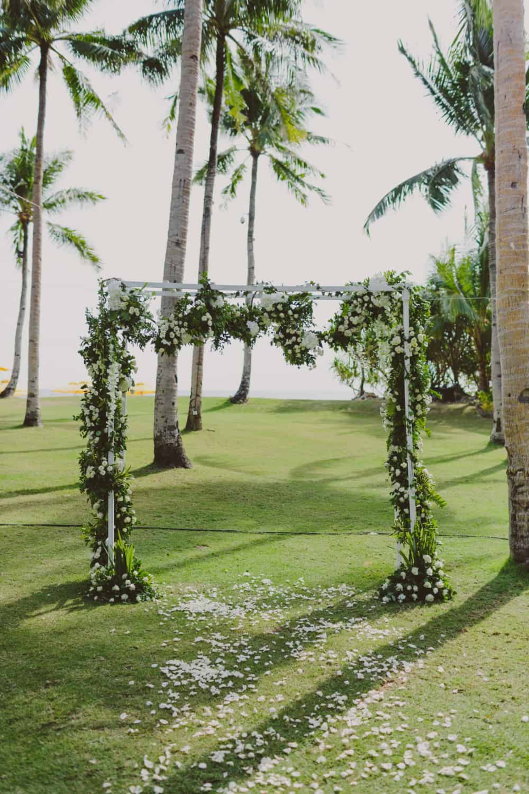 tropical green and white wedding arch