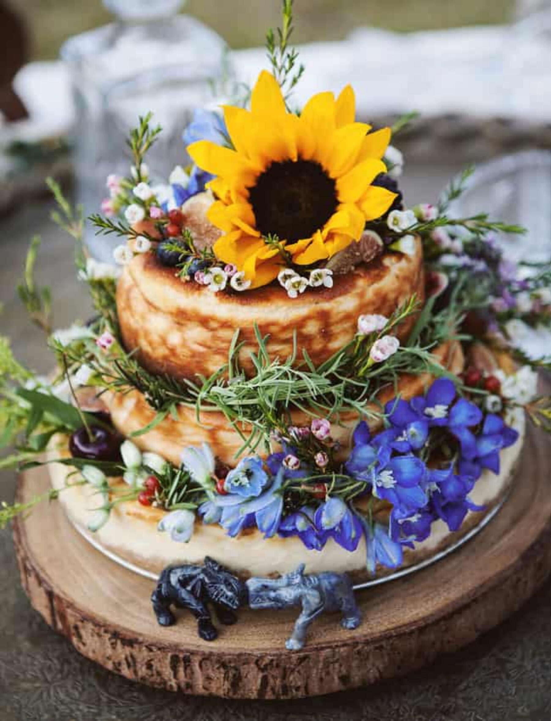 wedding cake with sunflower cake topper