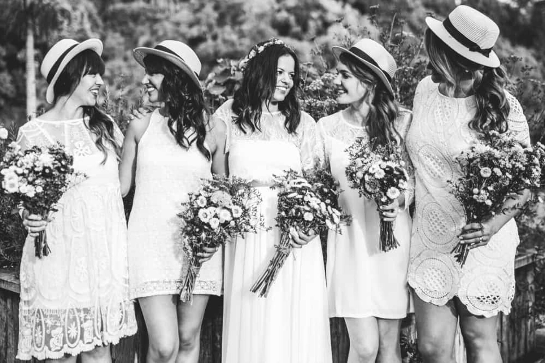 bridesmaids in white dresses and hats