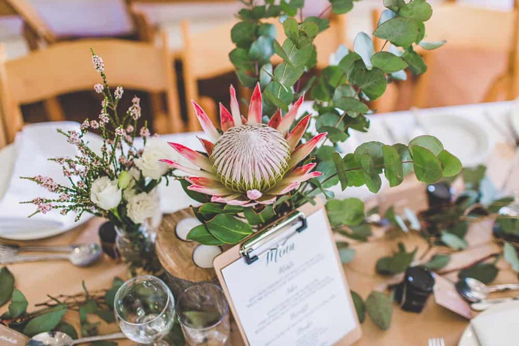 rustic wedding table setting with king proteas