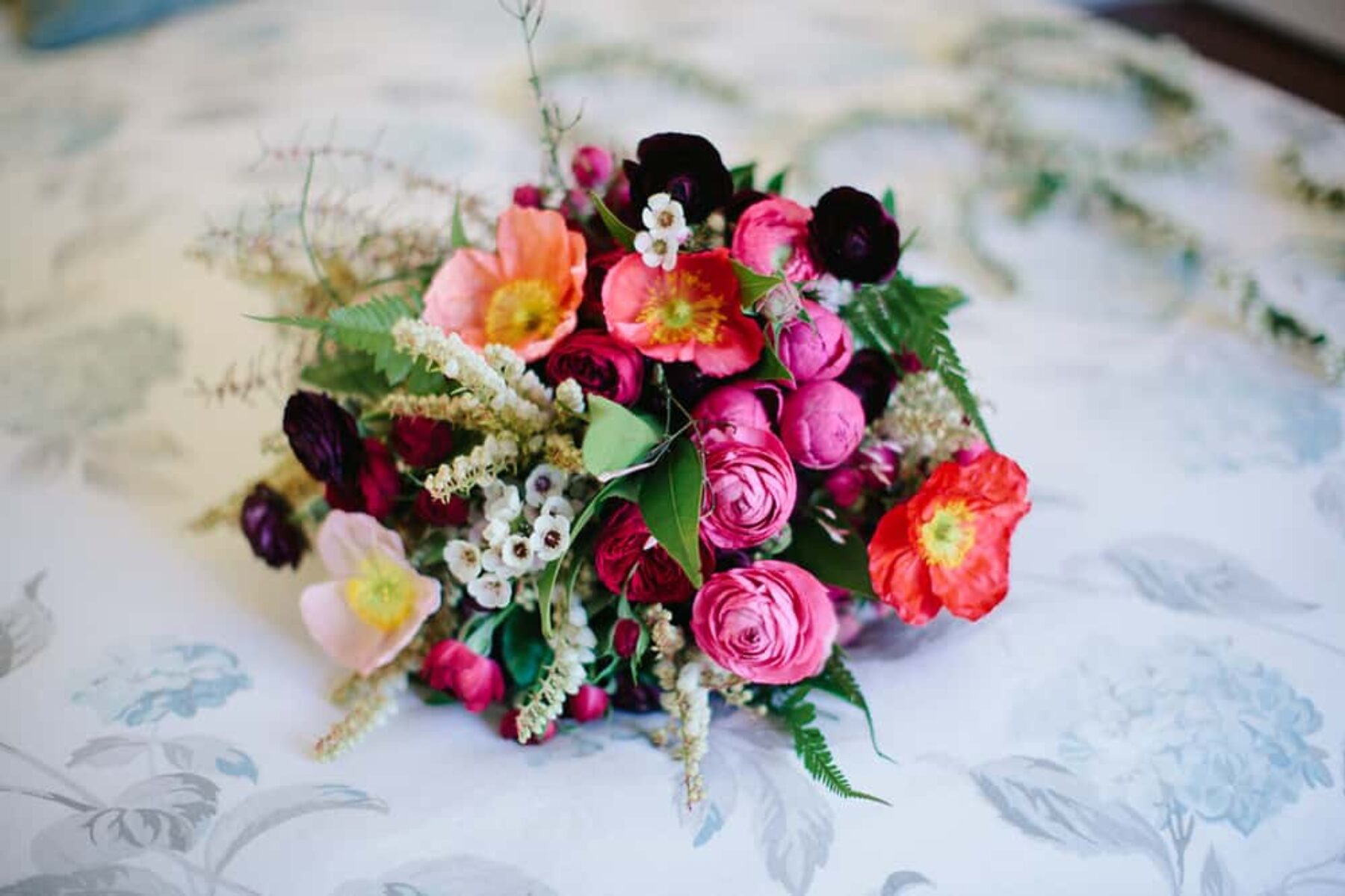pink poppy and ranunculus wedding bouquet