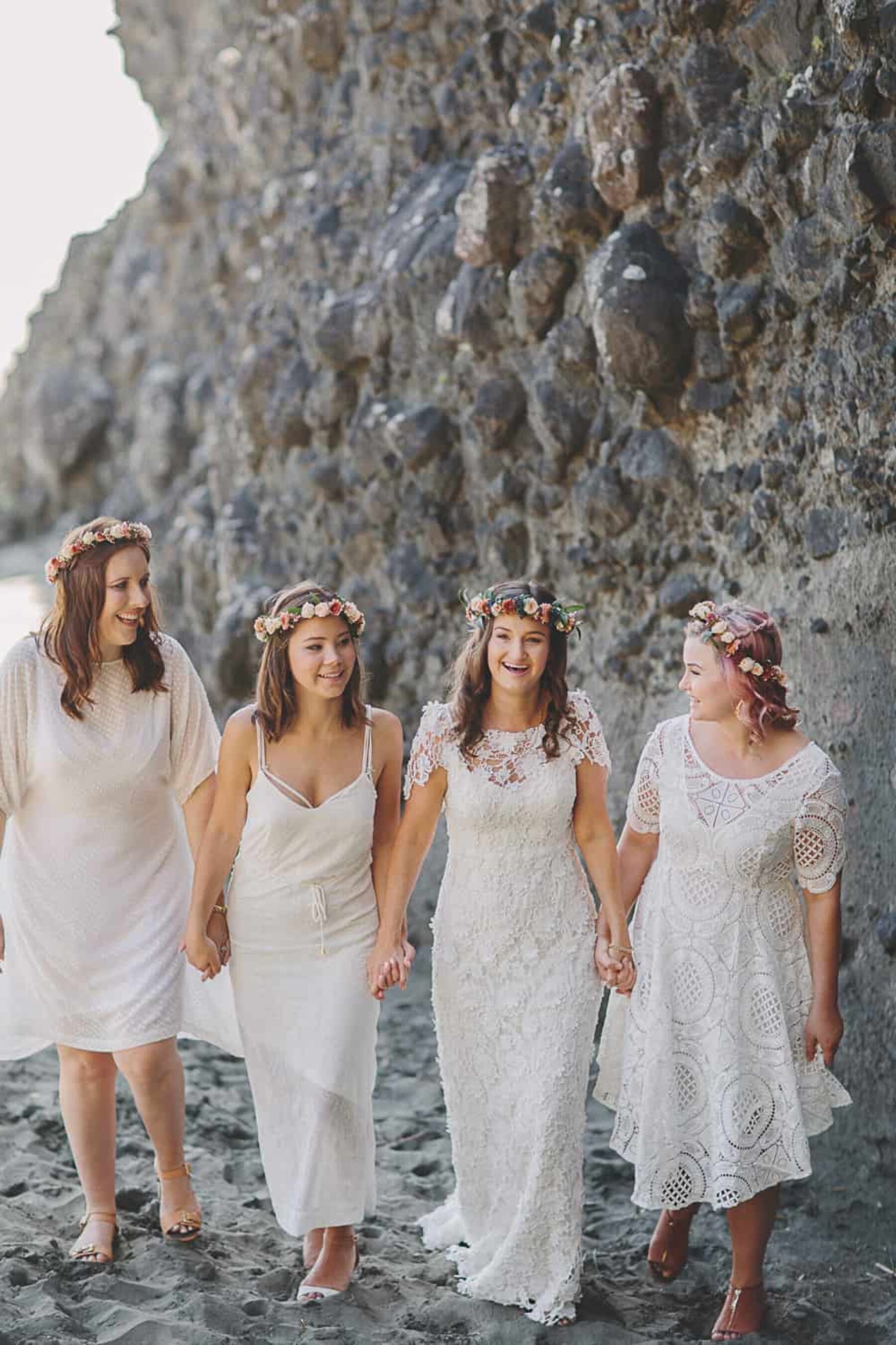 bridesmaids in mismatched white dresses