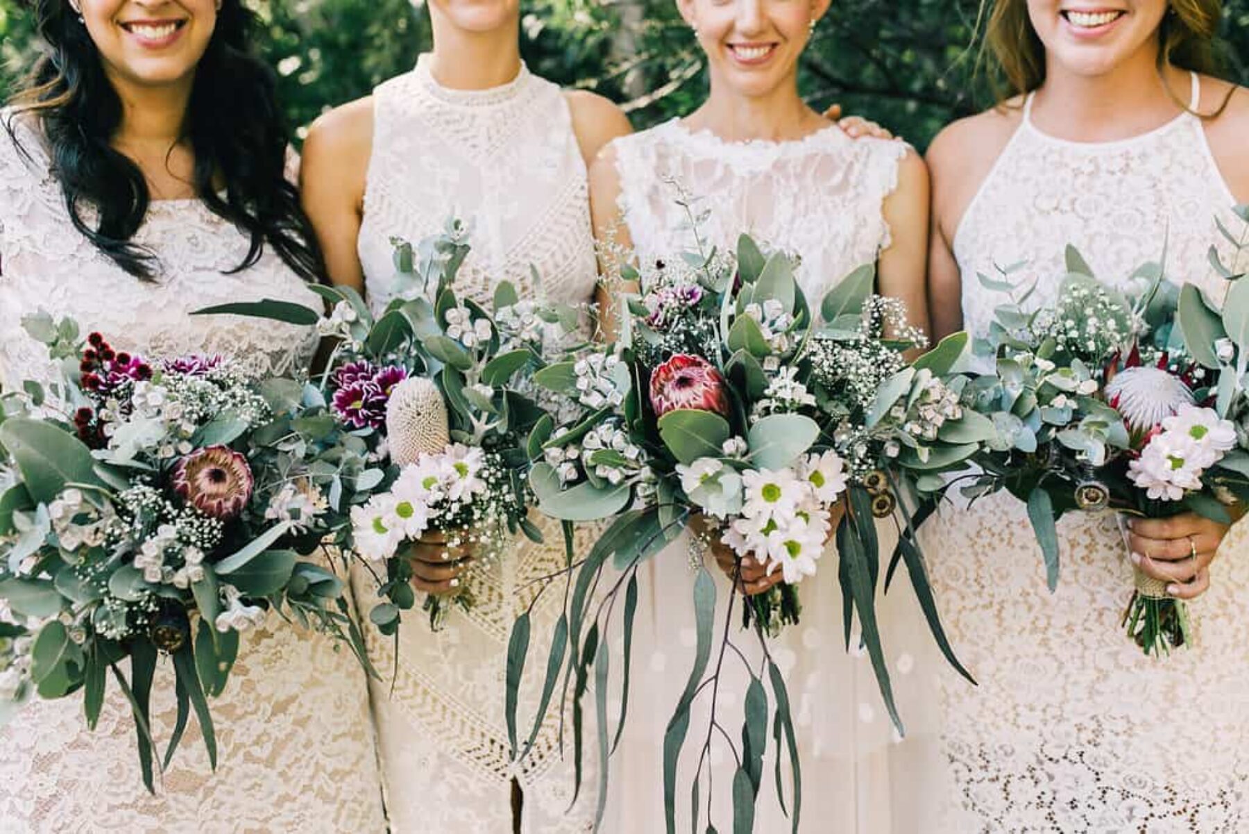 bridesmaids in white with DIY native bouquets