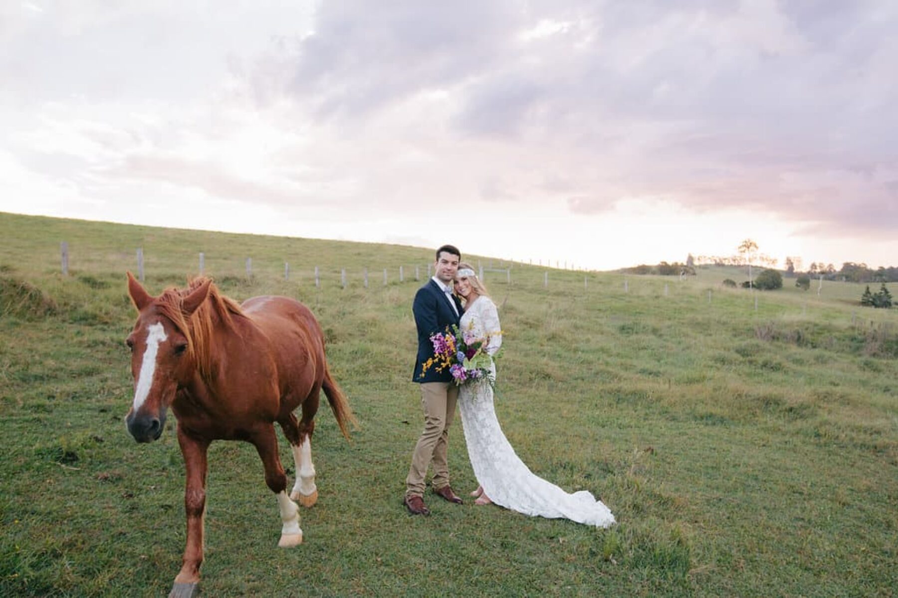 boho bride and grrom with horse