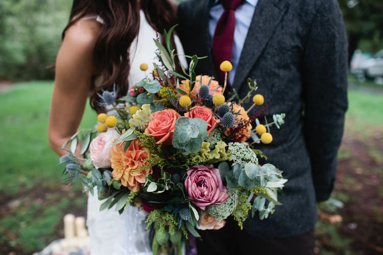 vibrant bouquet with roses and billy buttons