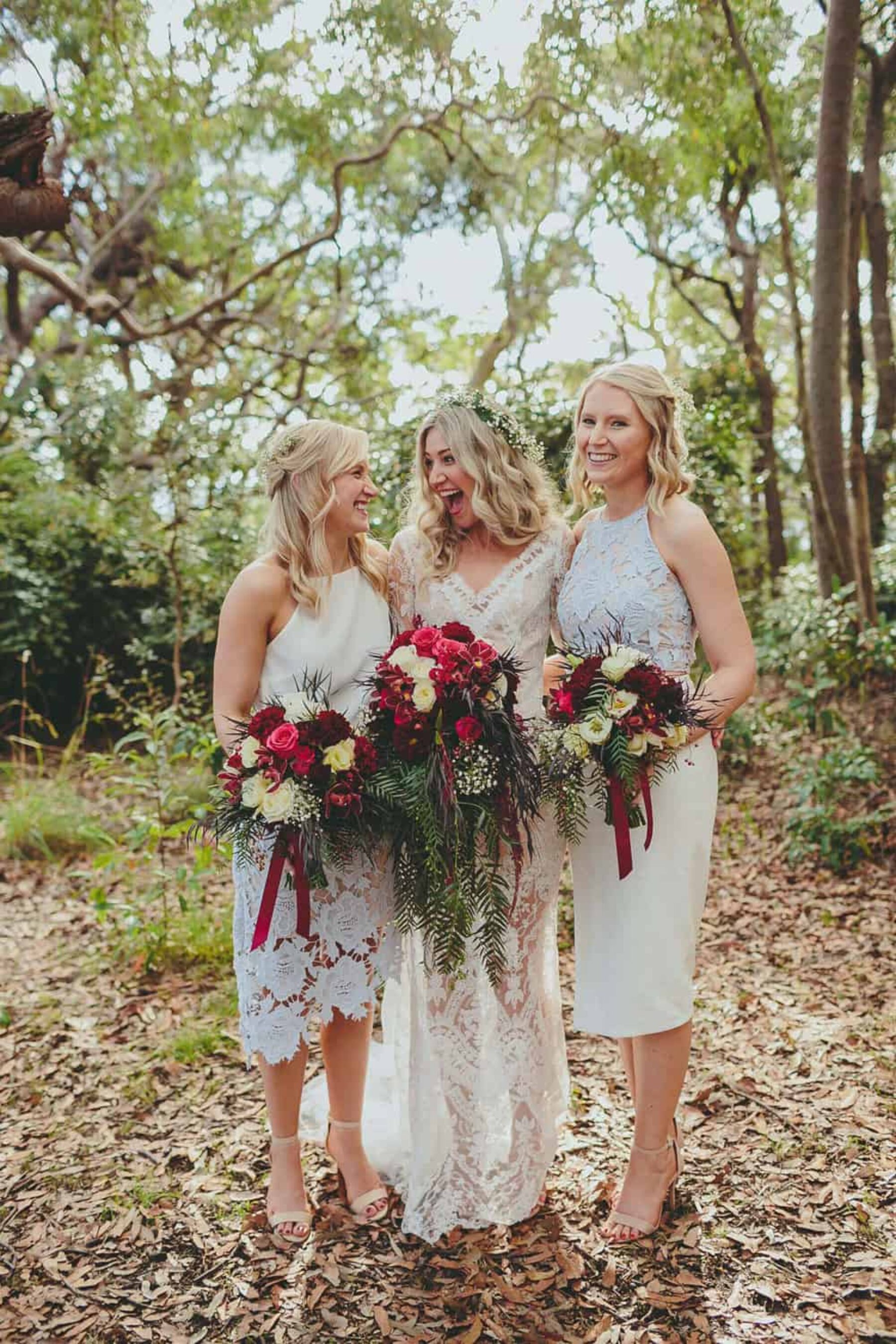 bride and bridesmaids with marsala toned bouquets