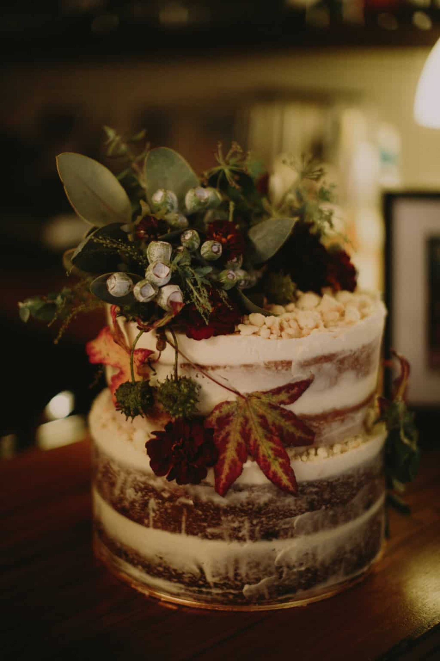 naked layer cake with native flower topper