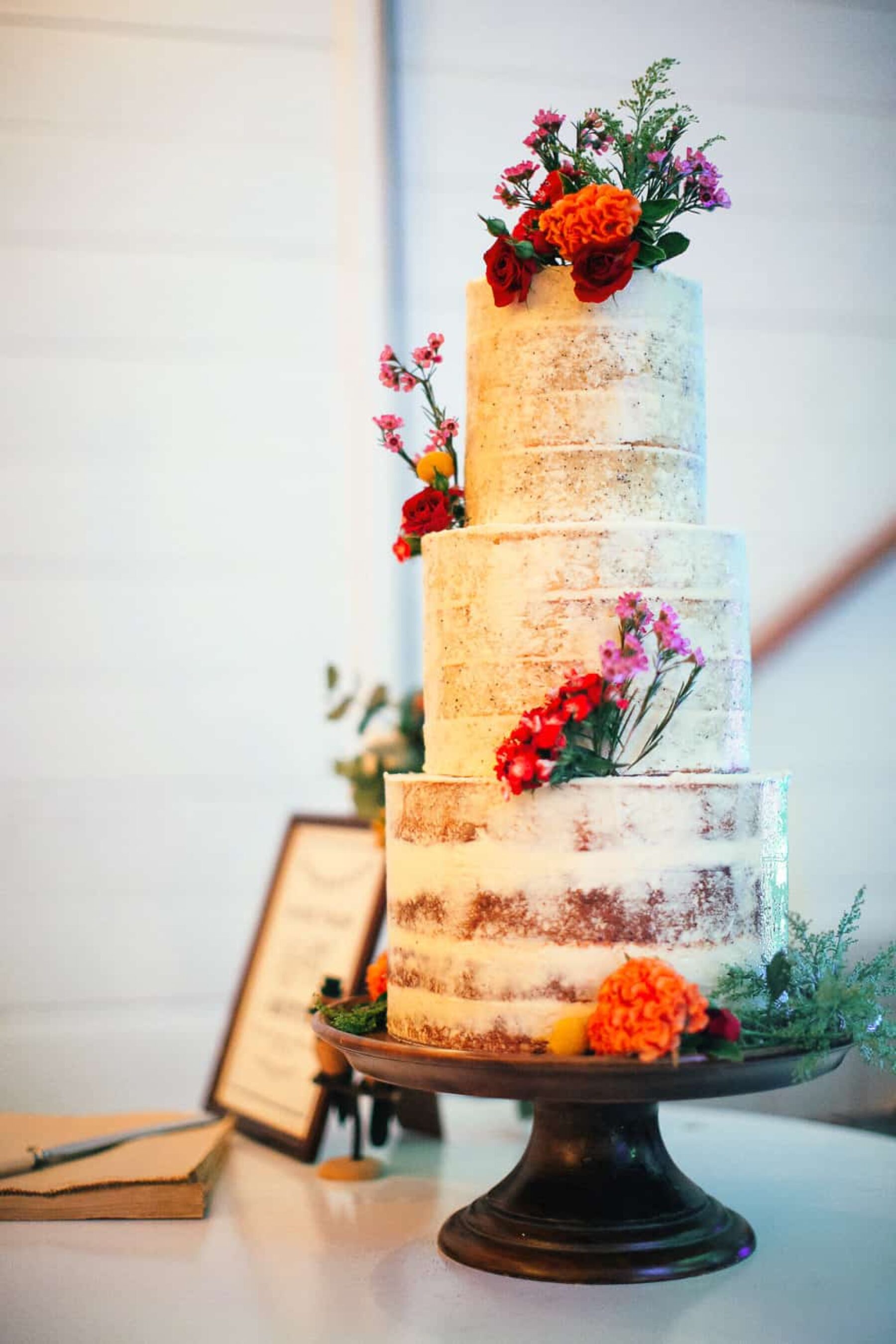 three tiered semi-naked wedding cake