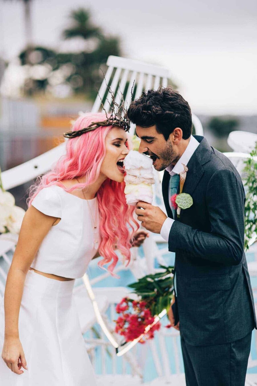 bride and groom eating candy floss