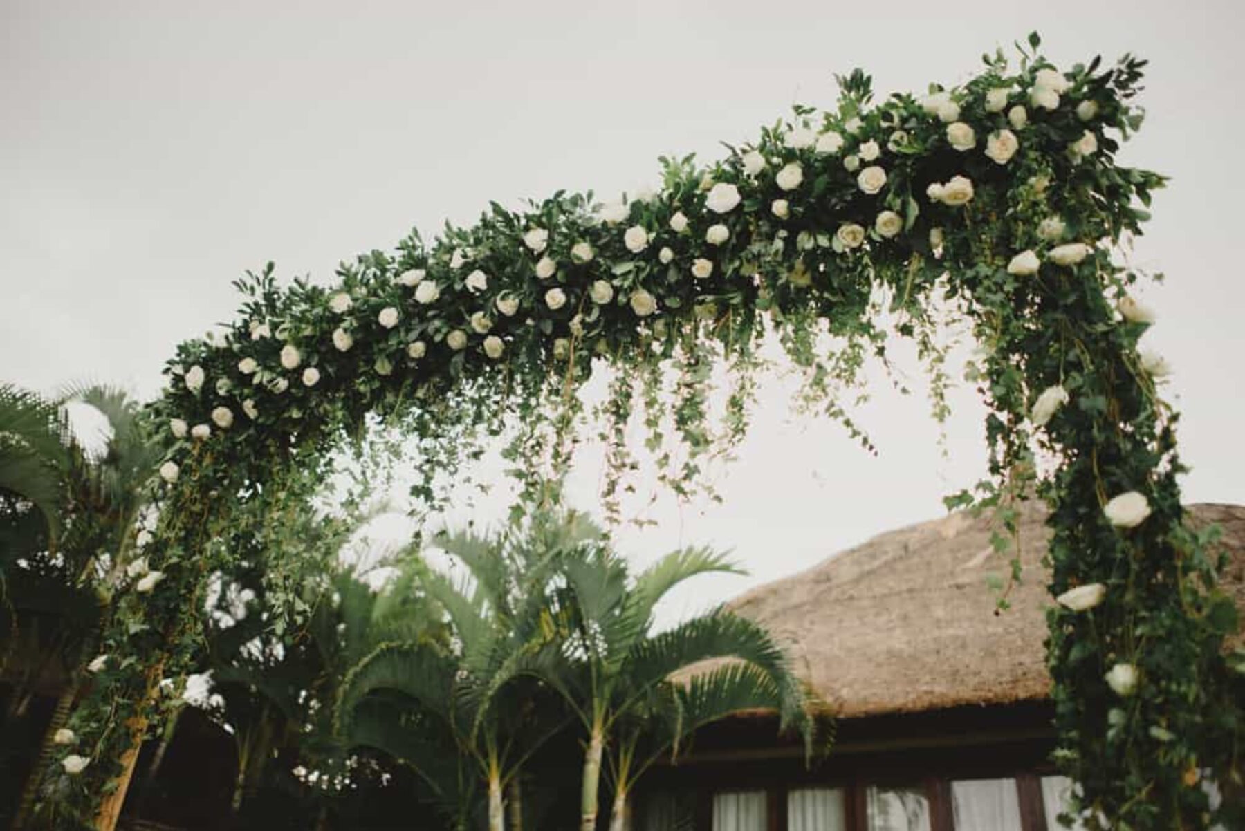 green and white floral wedding arch