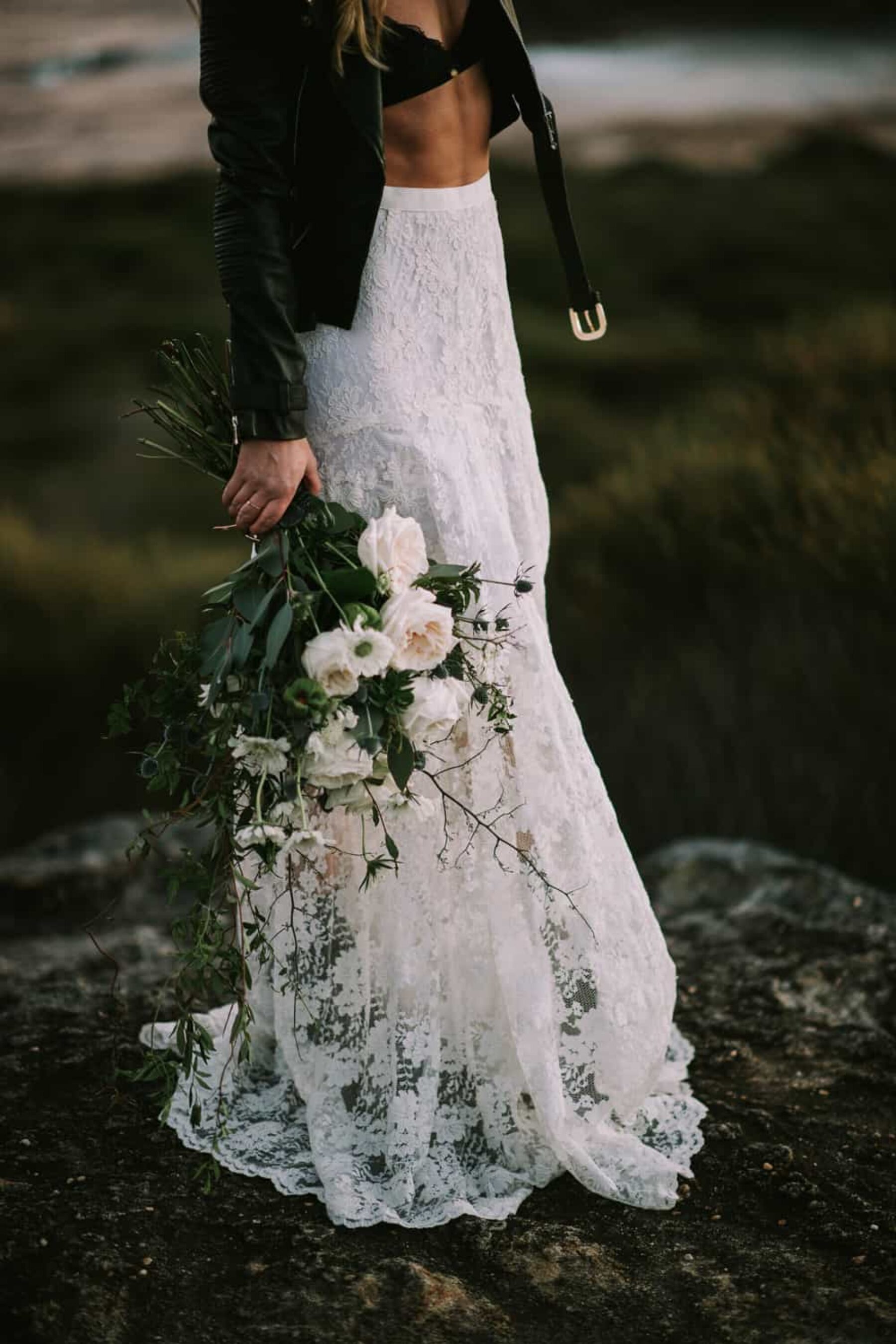 bohemian beach bride with green and white bouquet
