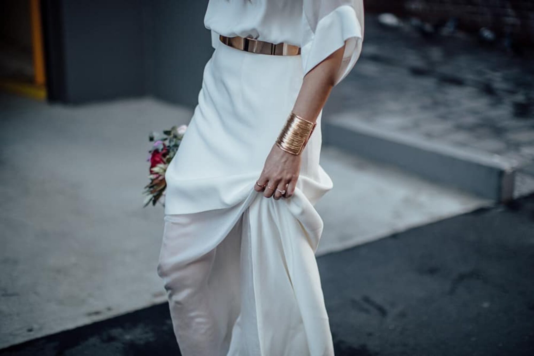 modern bride with gold belt and cuff