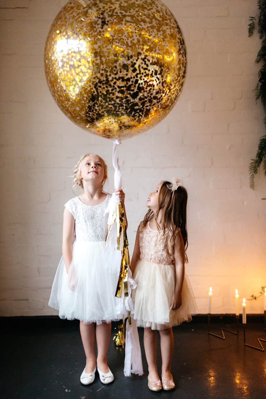flower girls with gold balloon