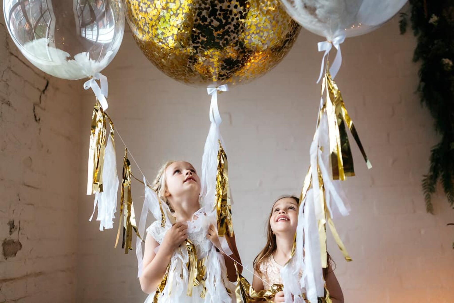 flower girls with gold balloons