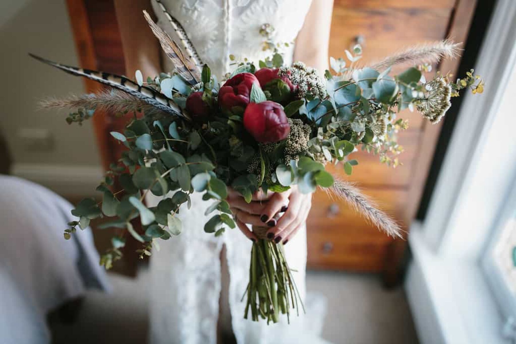 crimson peony and feather bouquet