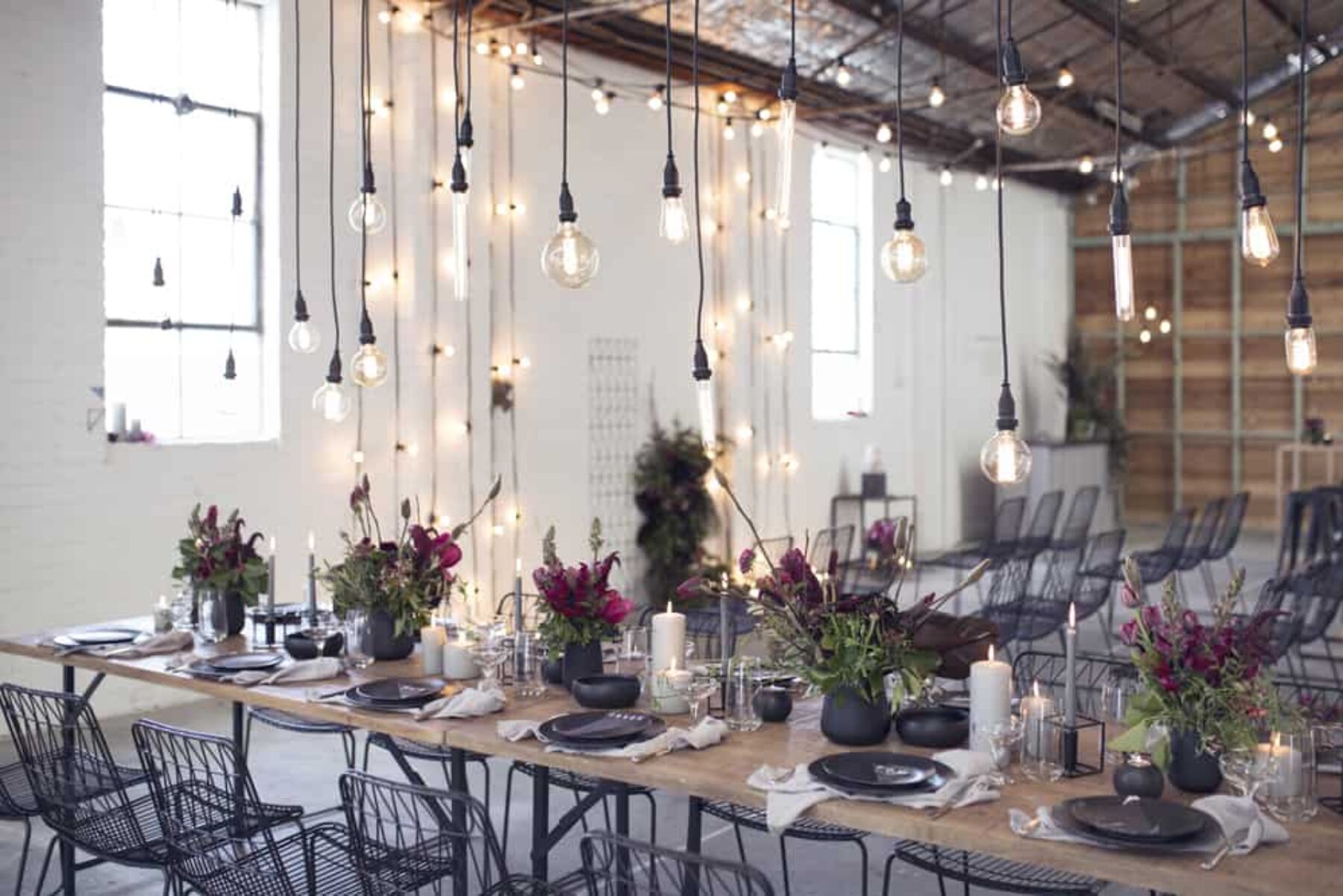 industrial wedding reception with hanging bare bulbs