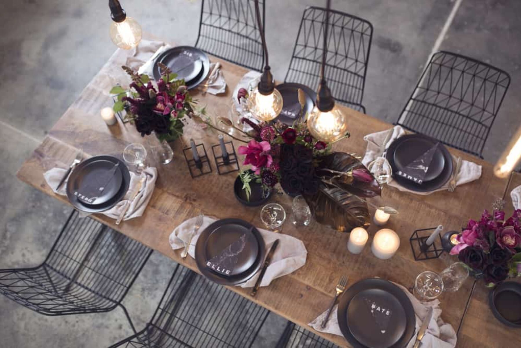 Modern wedding tablescape with black wire chairs