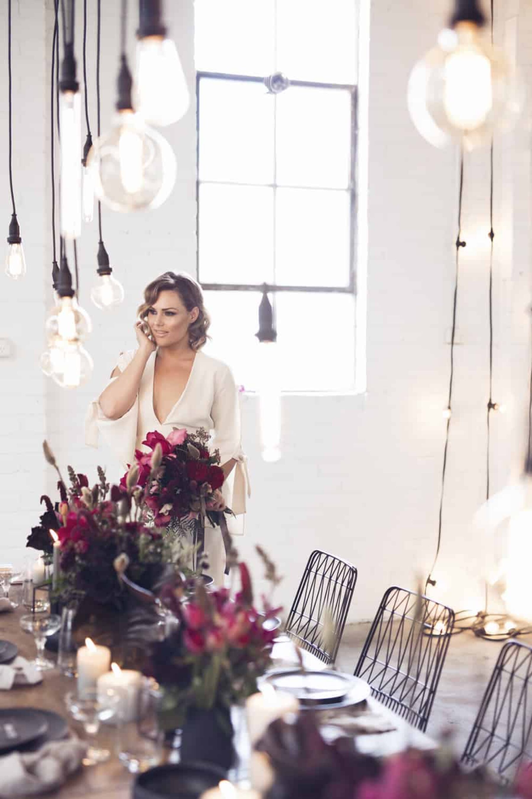 industrial wedding reception with hanging bare bulbs