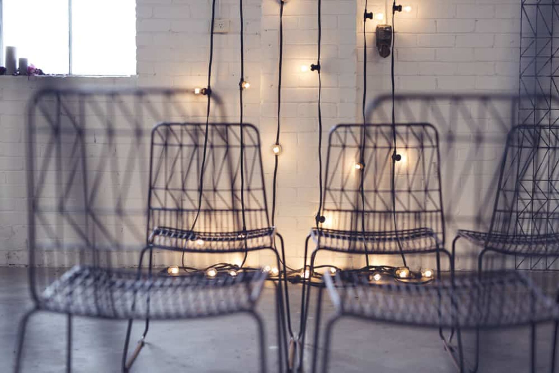 geometric black wire chairs