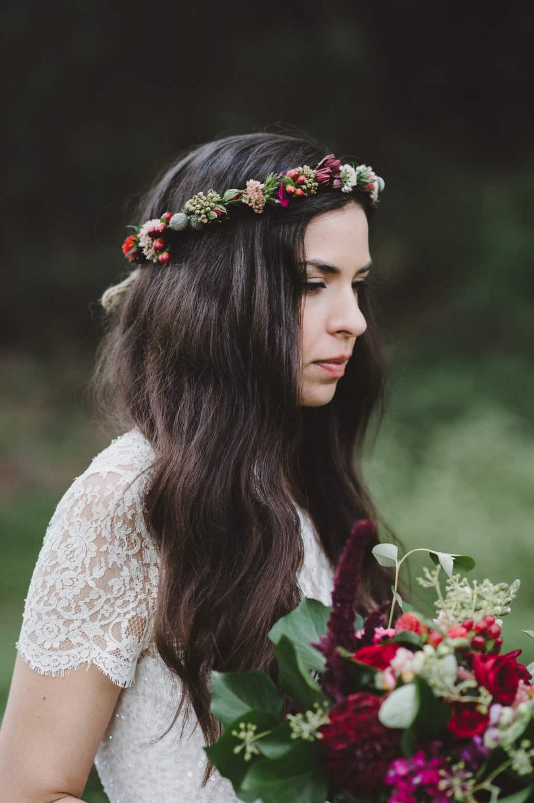 bride with berry-toned bouquet and flower crown