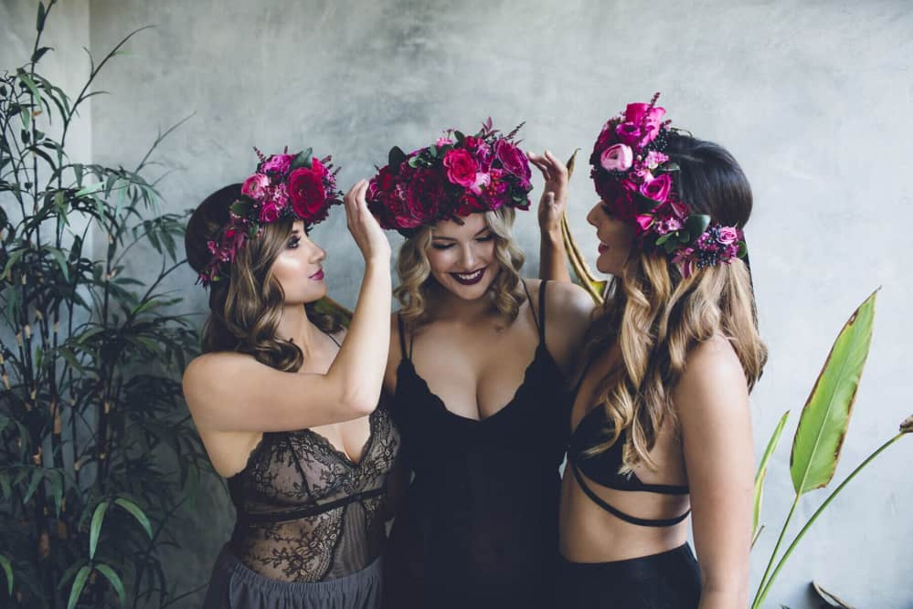 bridesmaids wearing magenta flower crowns