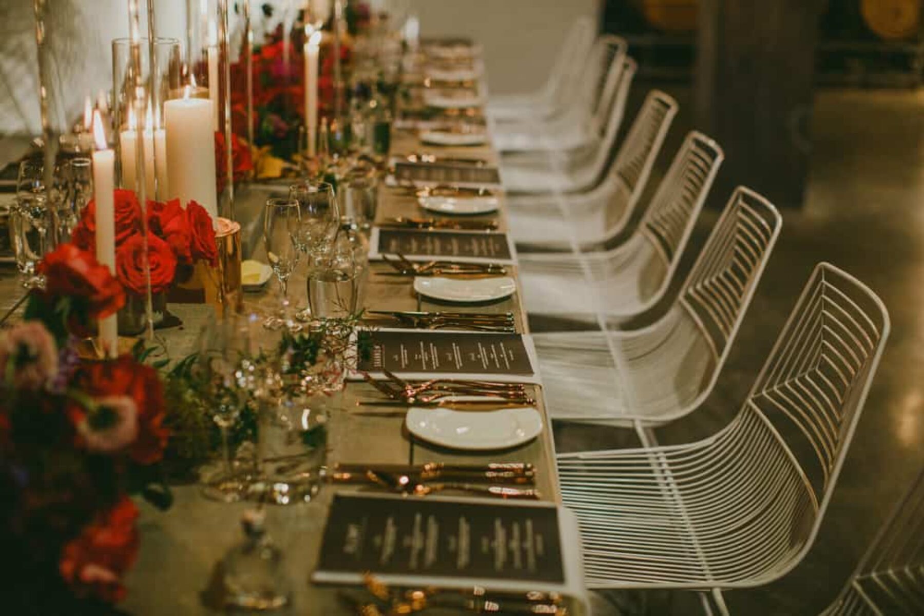 modern wedding tablescape with white wire chairs