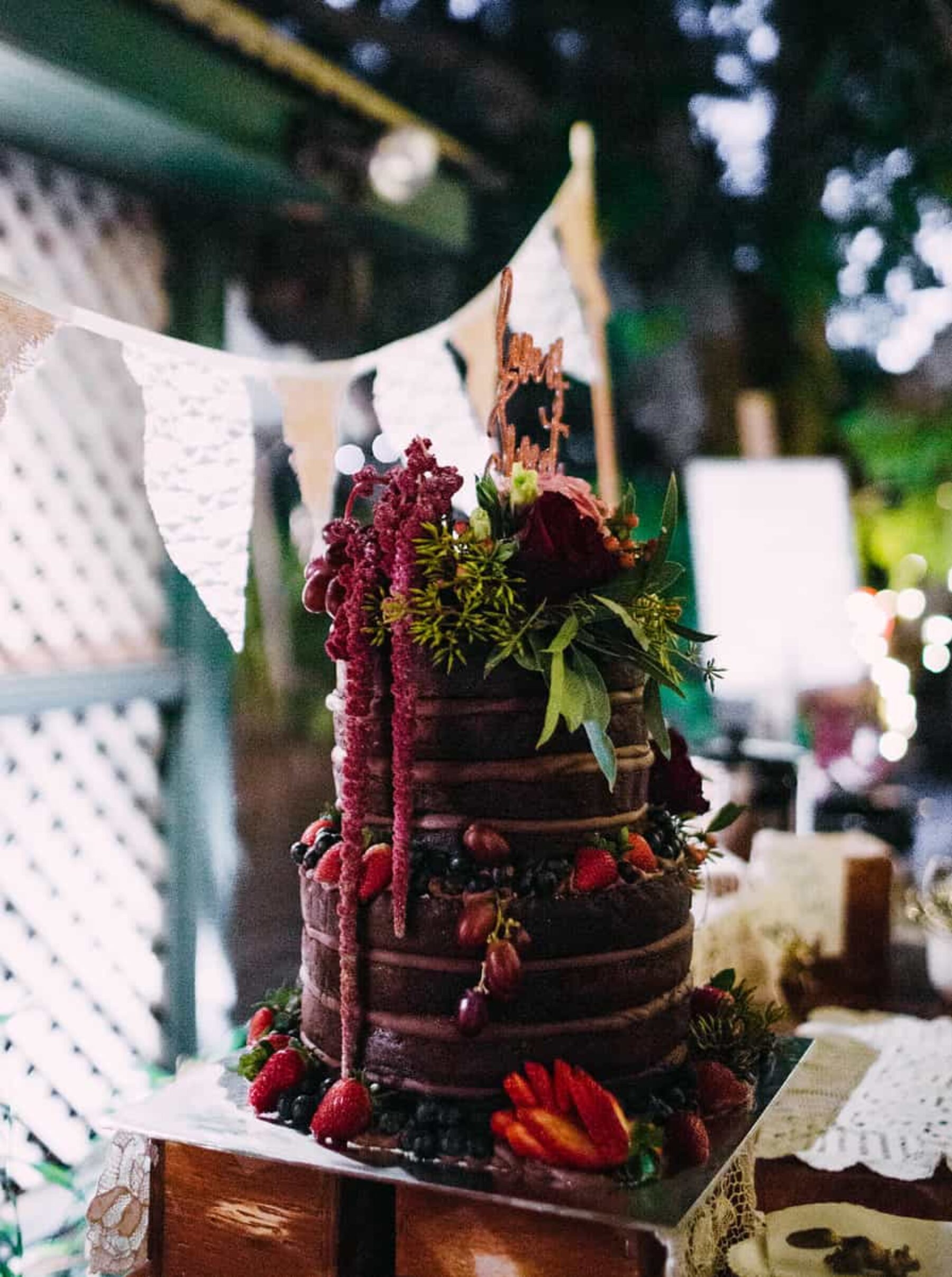 chocolate wedding cake with amaranth topper