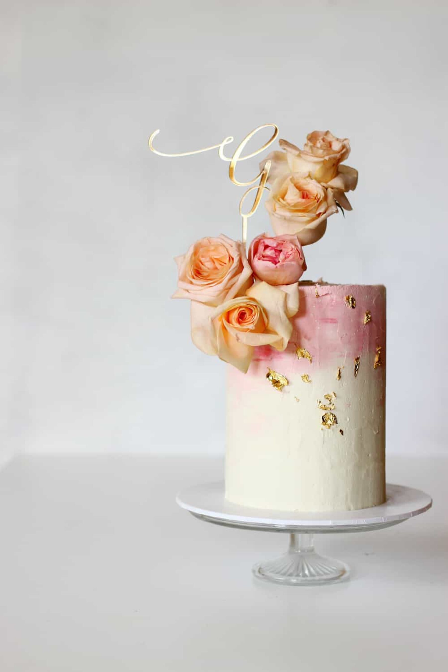 pink wedding cake with gold leaf