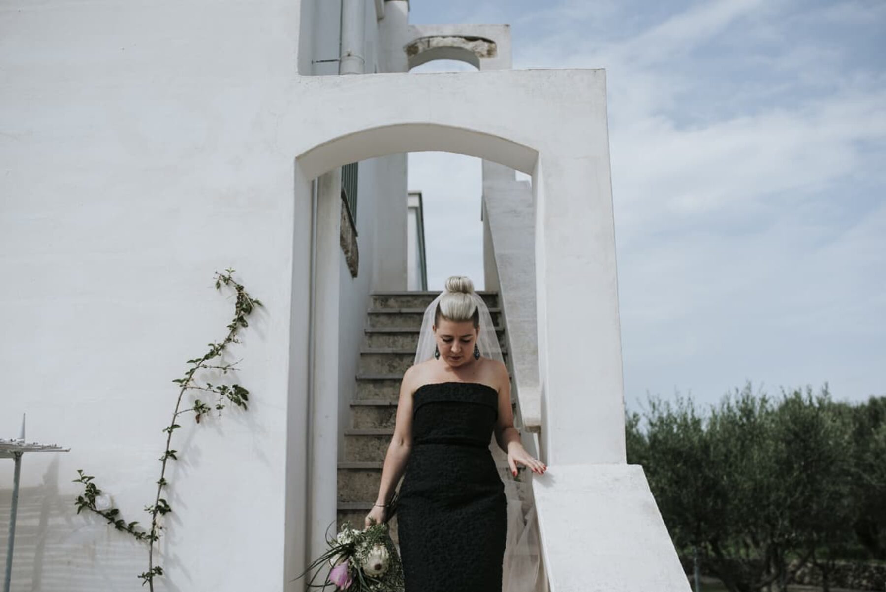 bride in Alex Perry black wedding dress