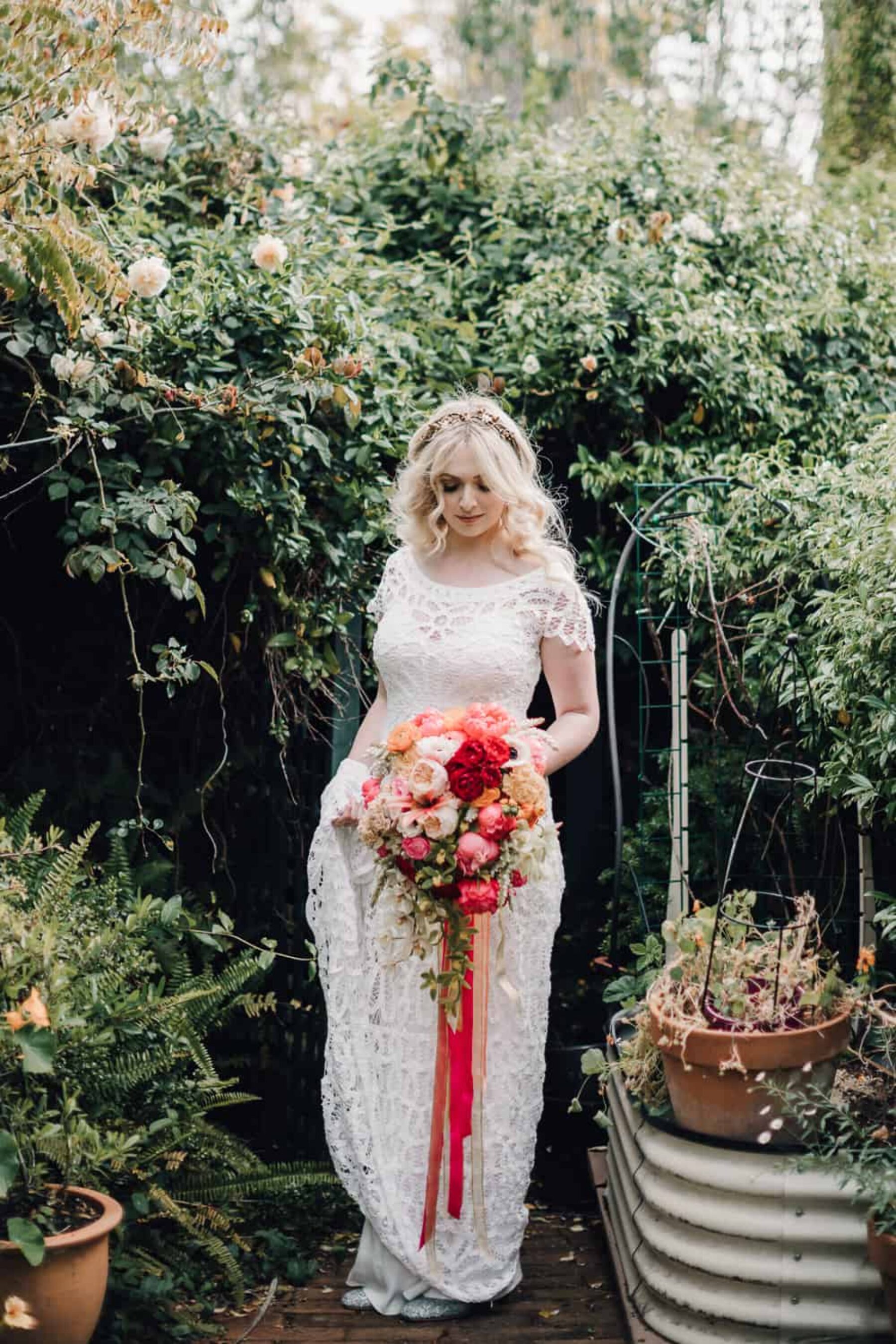 Rue de Seine bride with peach and pink peony bouquet