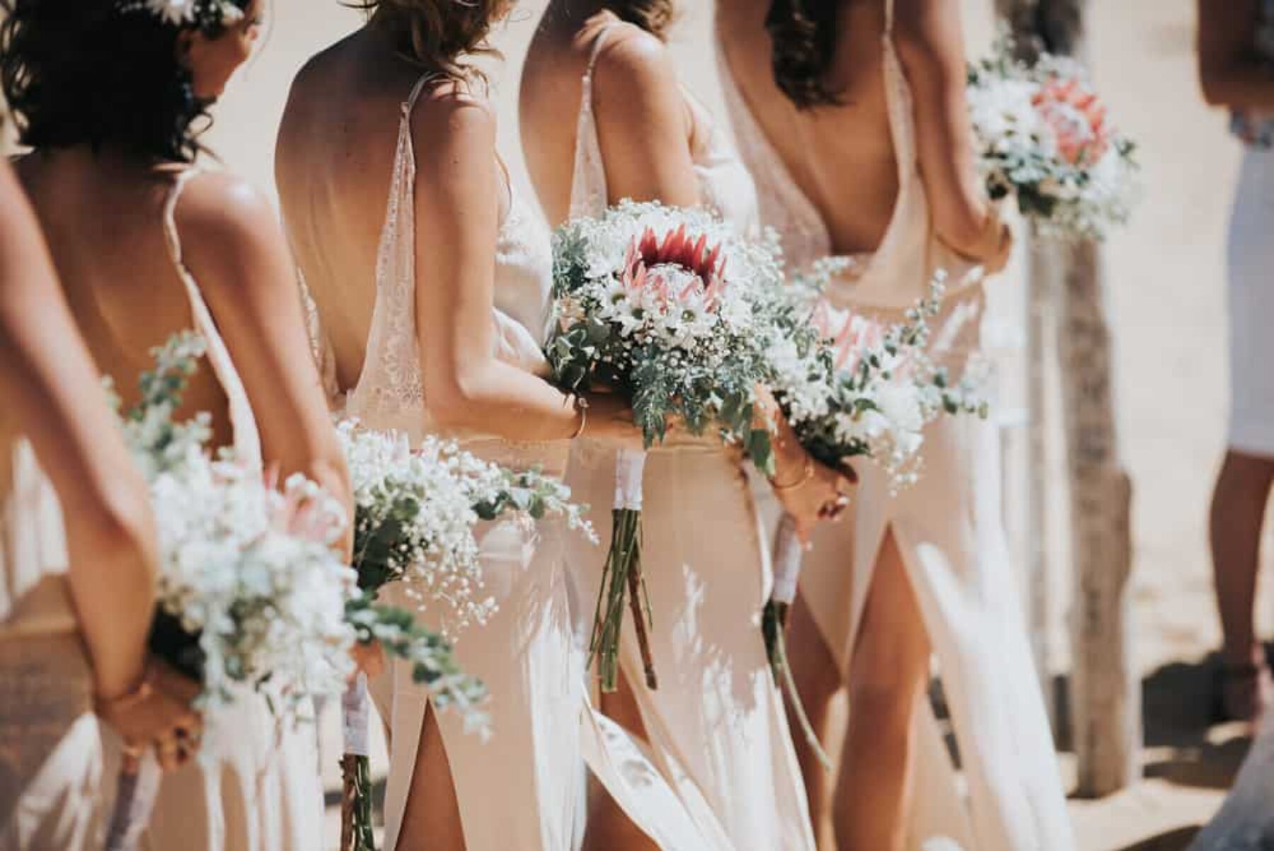 bridesmaids with protea bouquets