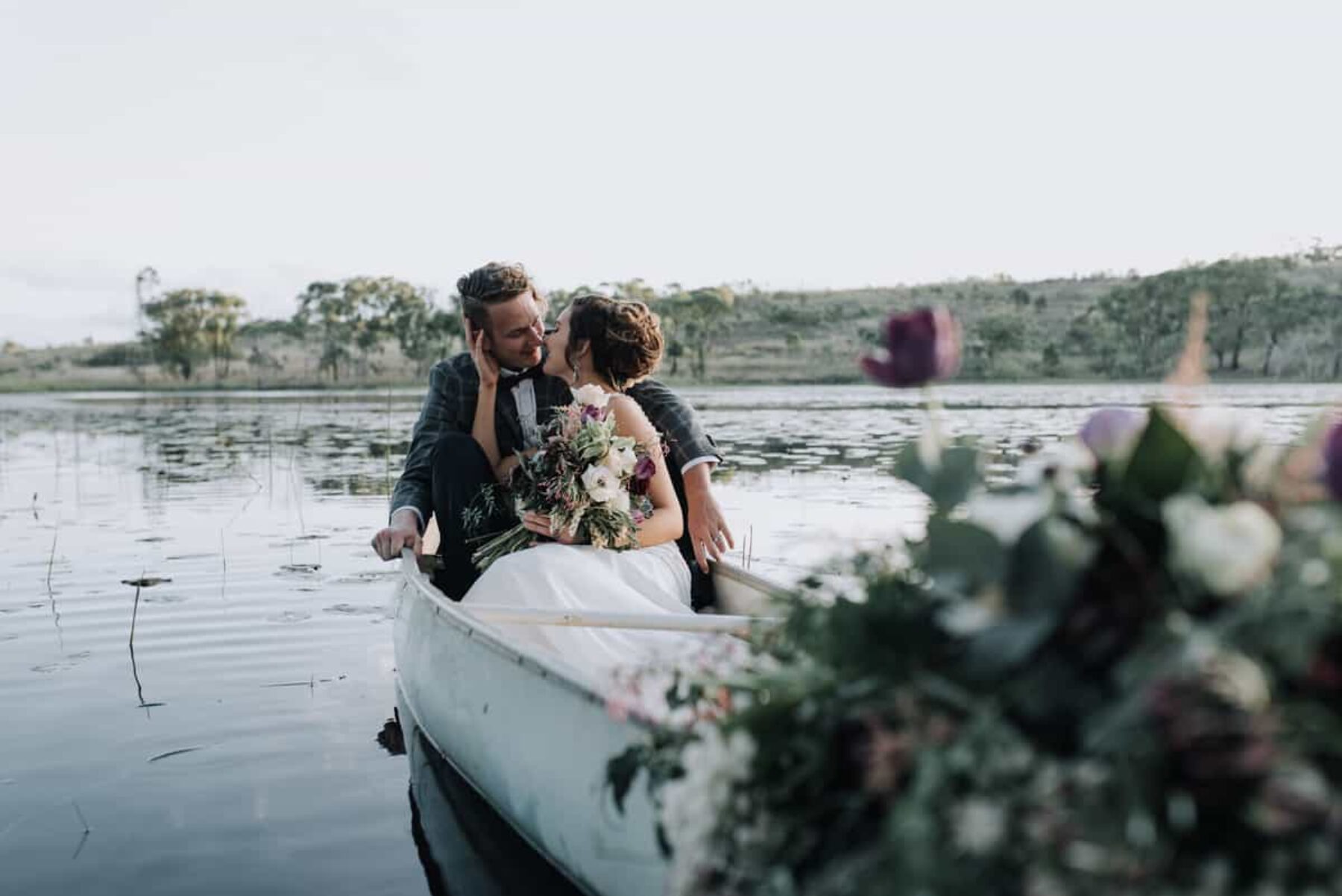bride and groom in row boat