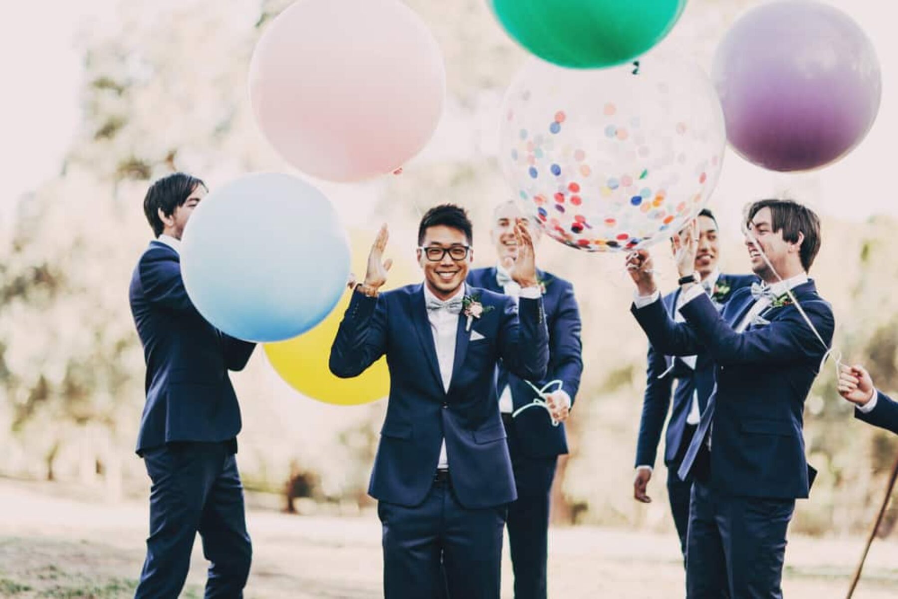 groomsmen with giant colour balloons