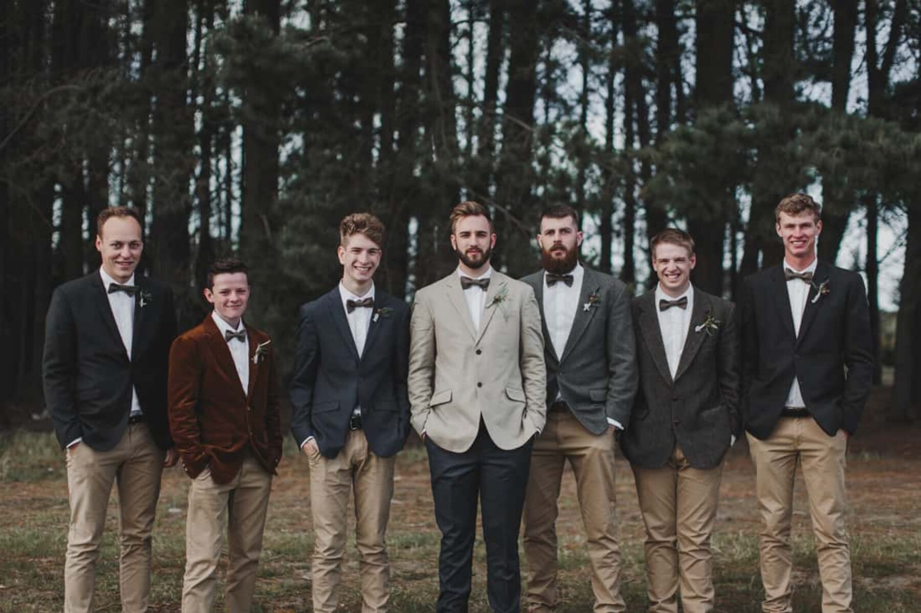 groomsmen in chinos and mixed blazers