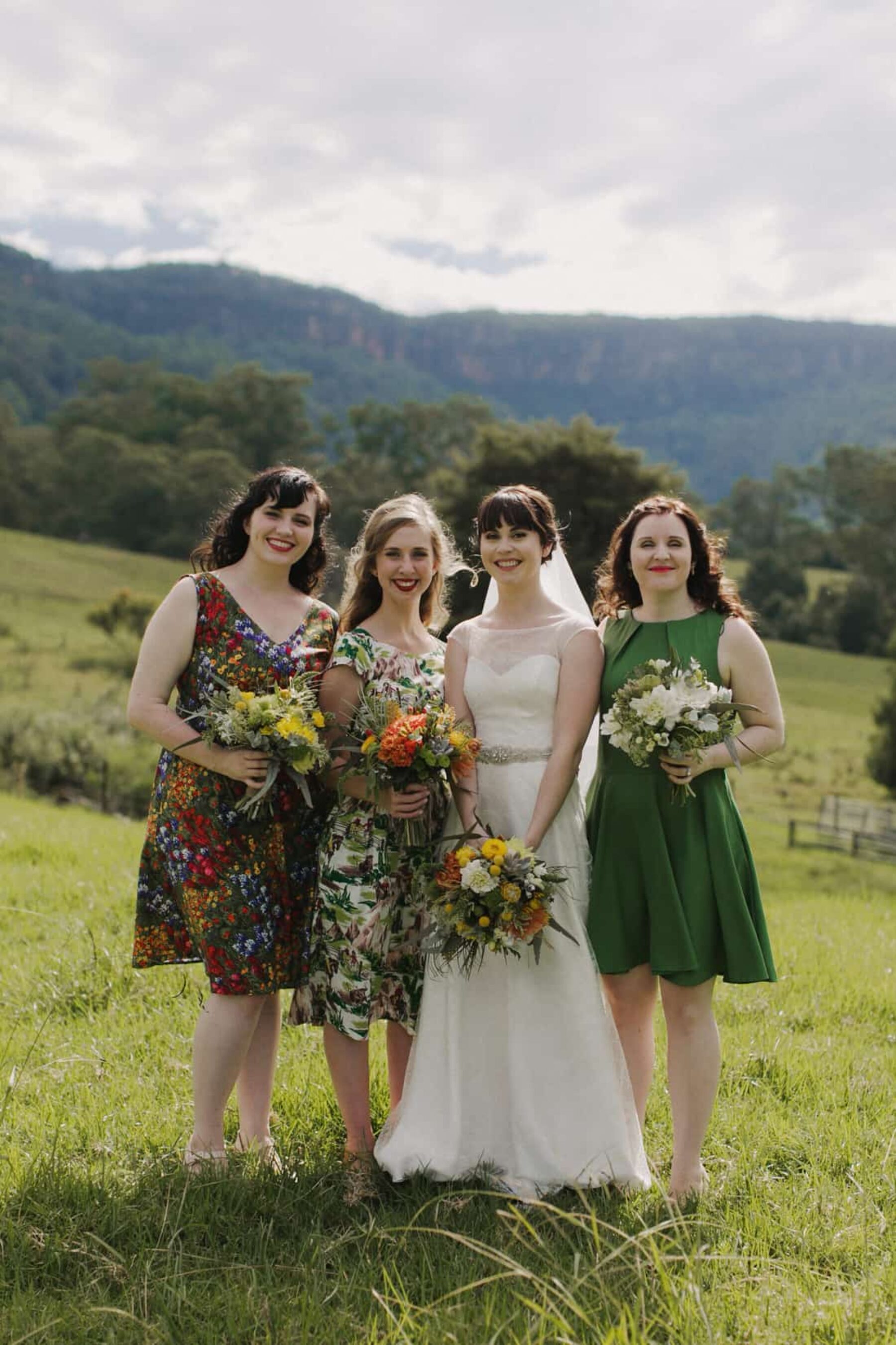 mixed bridesmaid dresses in greens and florals