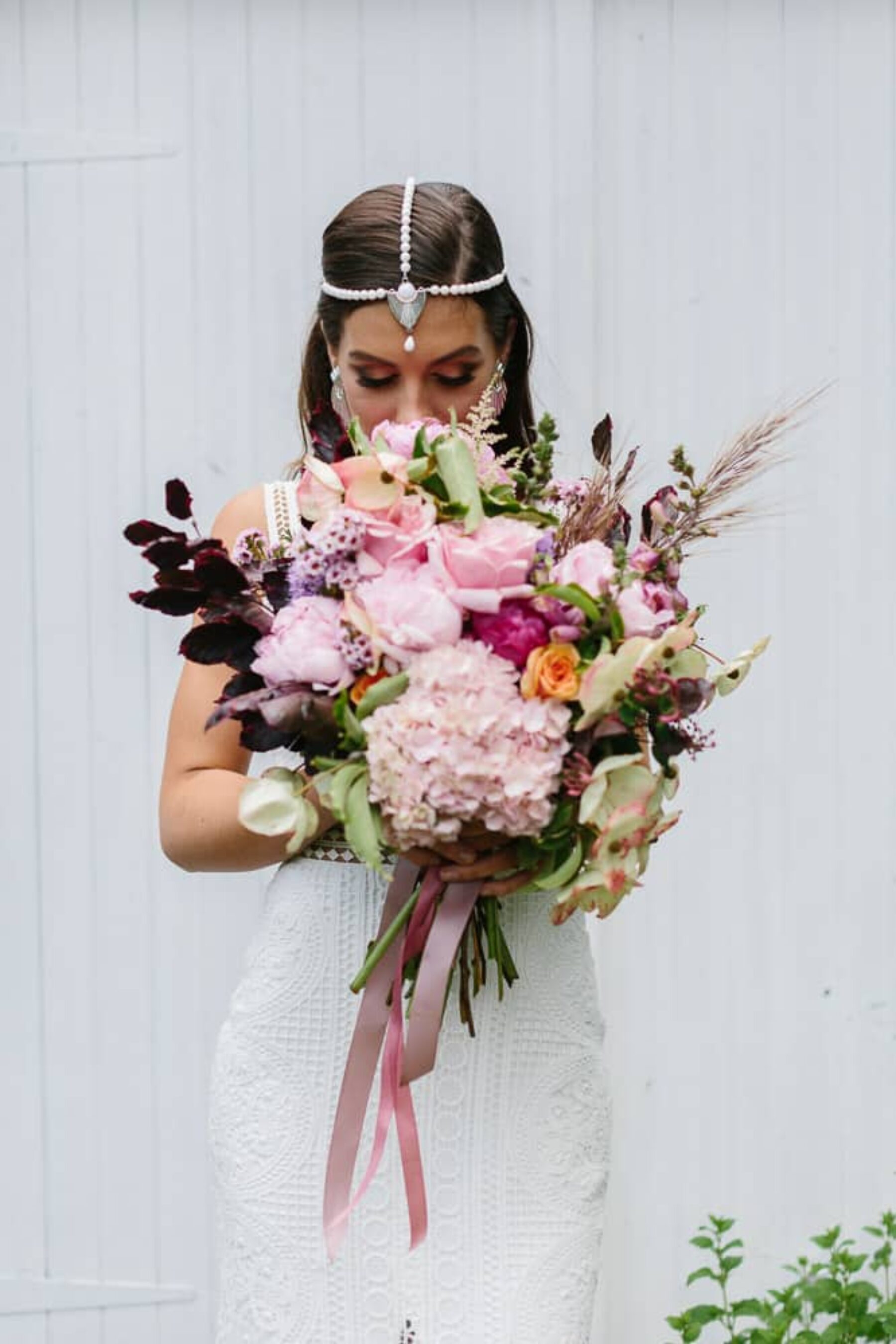 unstructured pink bridal bouquet with hydrangea and peonies