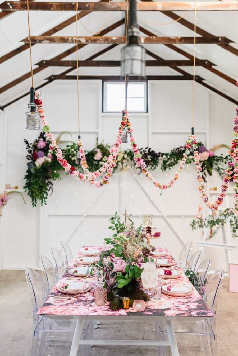 Floral tablescape with hanging floral garlands