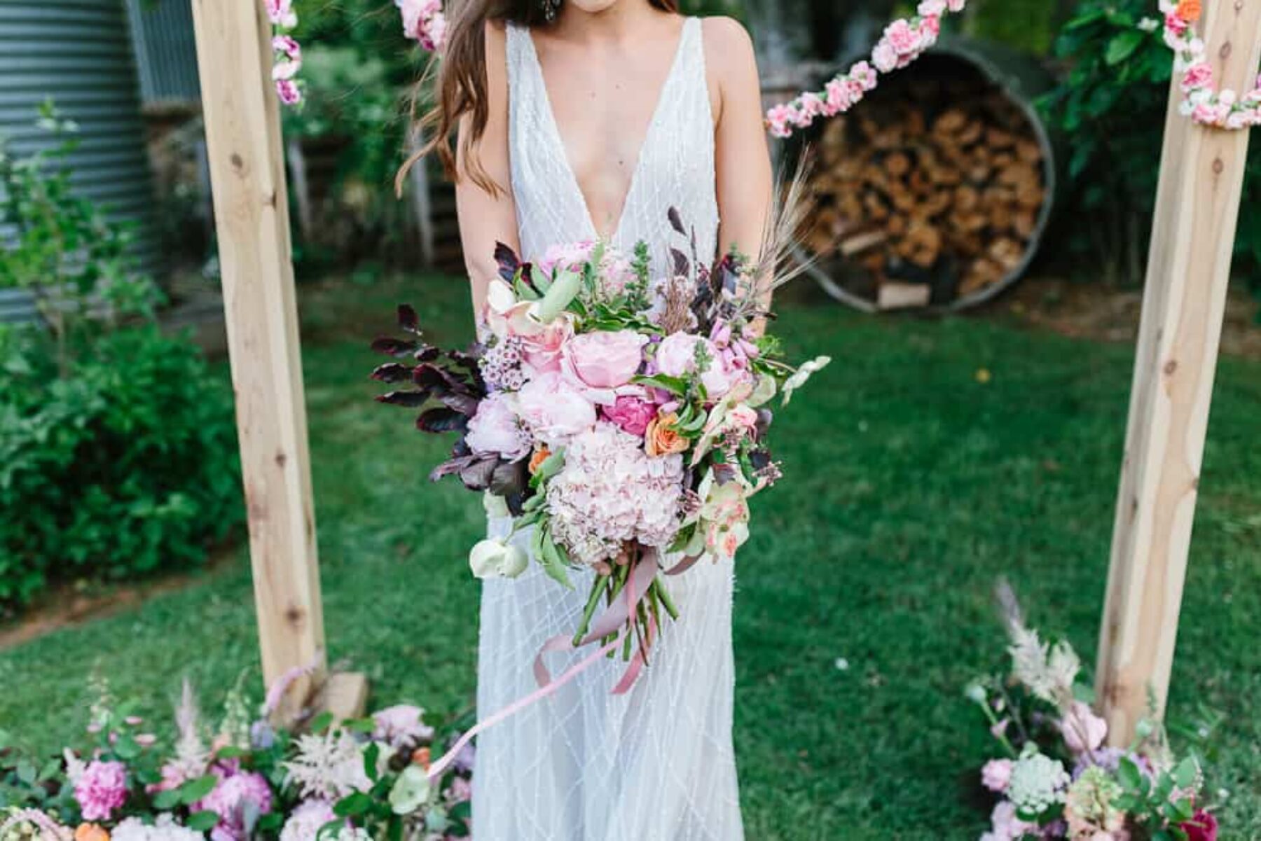 unstructured pink bridal bouquet with hydrangea and peonies