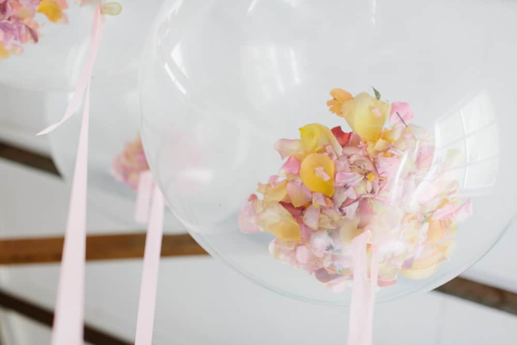 giant balloons filled with petal confetti