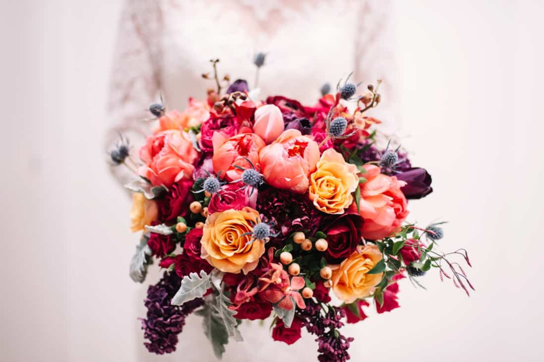 peach bouquet with tulips, roses and thistle