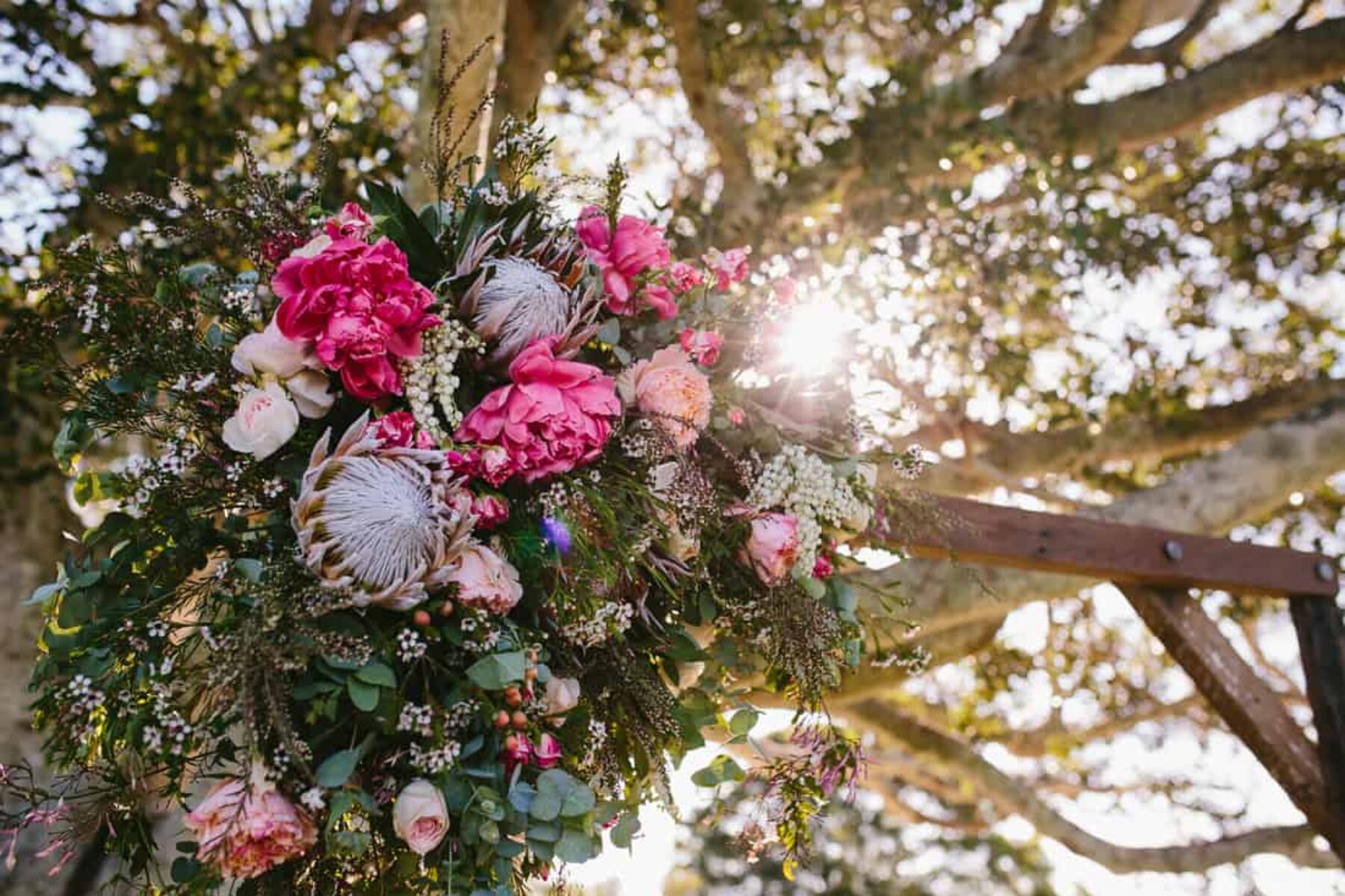 timber floral wedding arbour