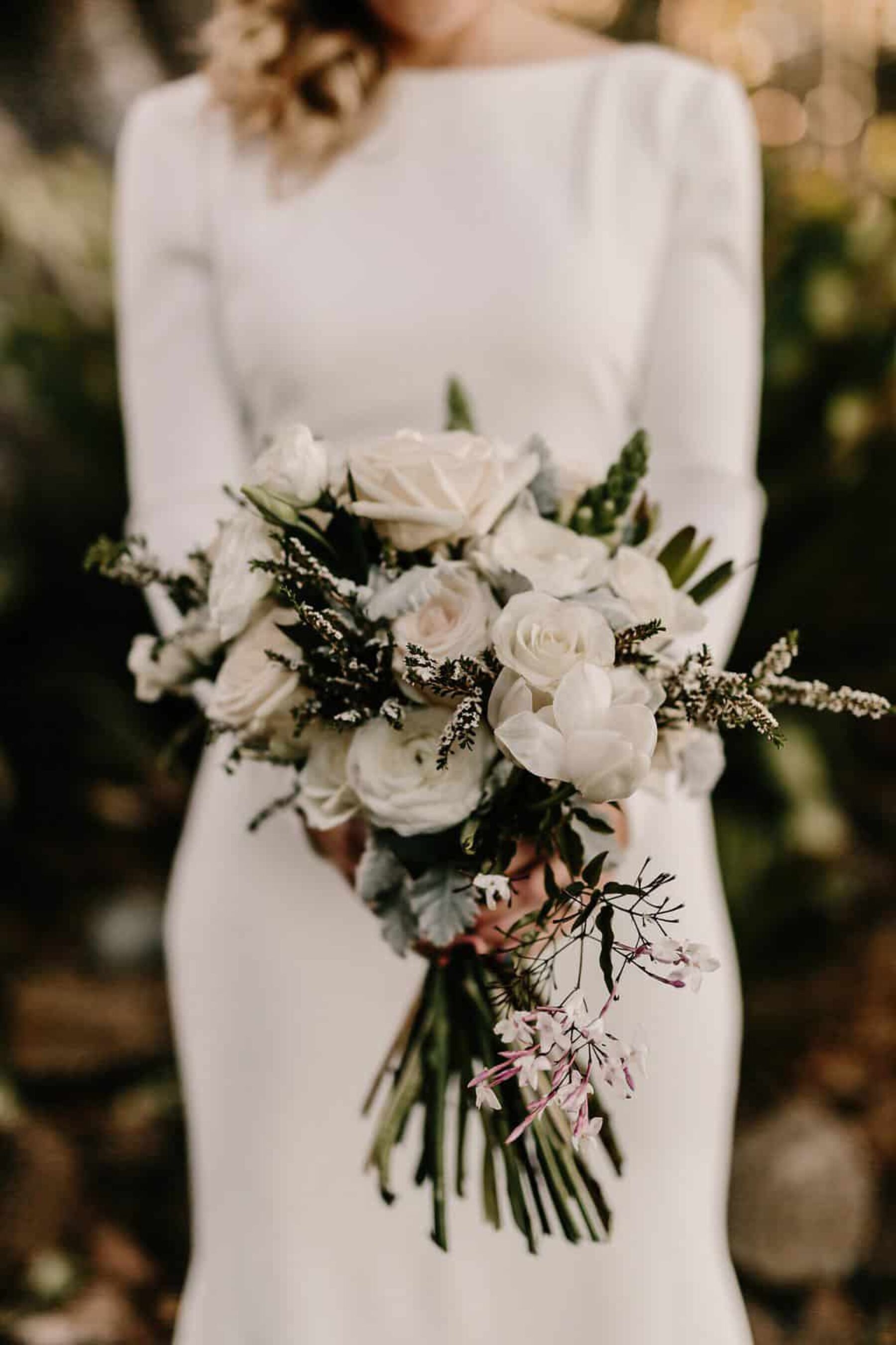 minimal bride with white bouquet