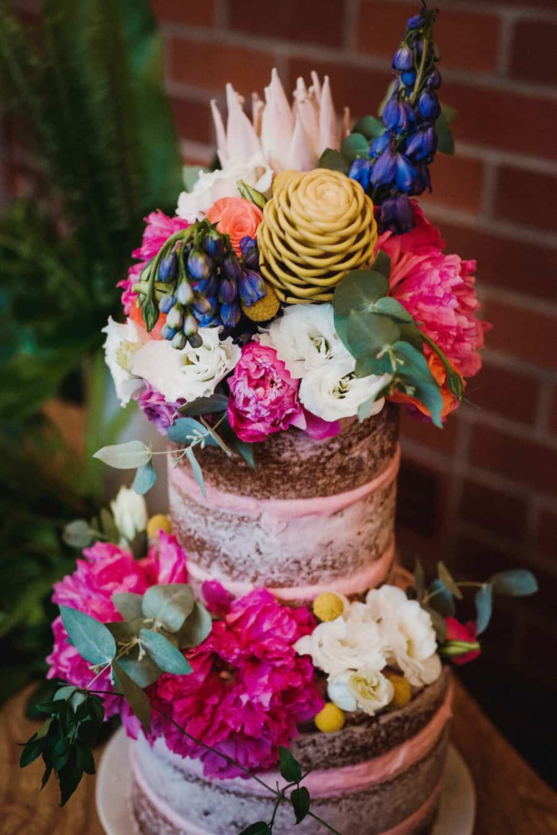 vegan pink wedding cake with gorgeous fresh flowers