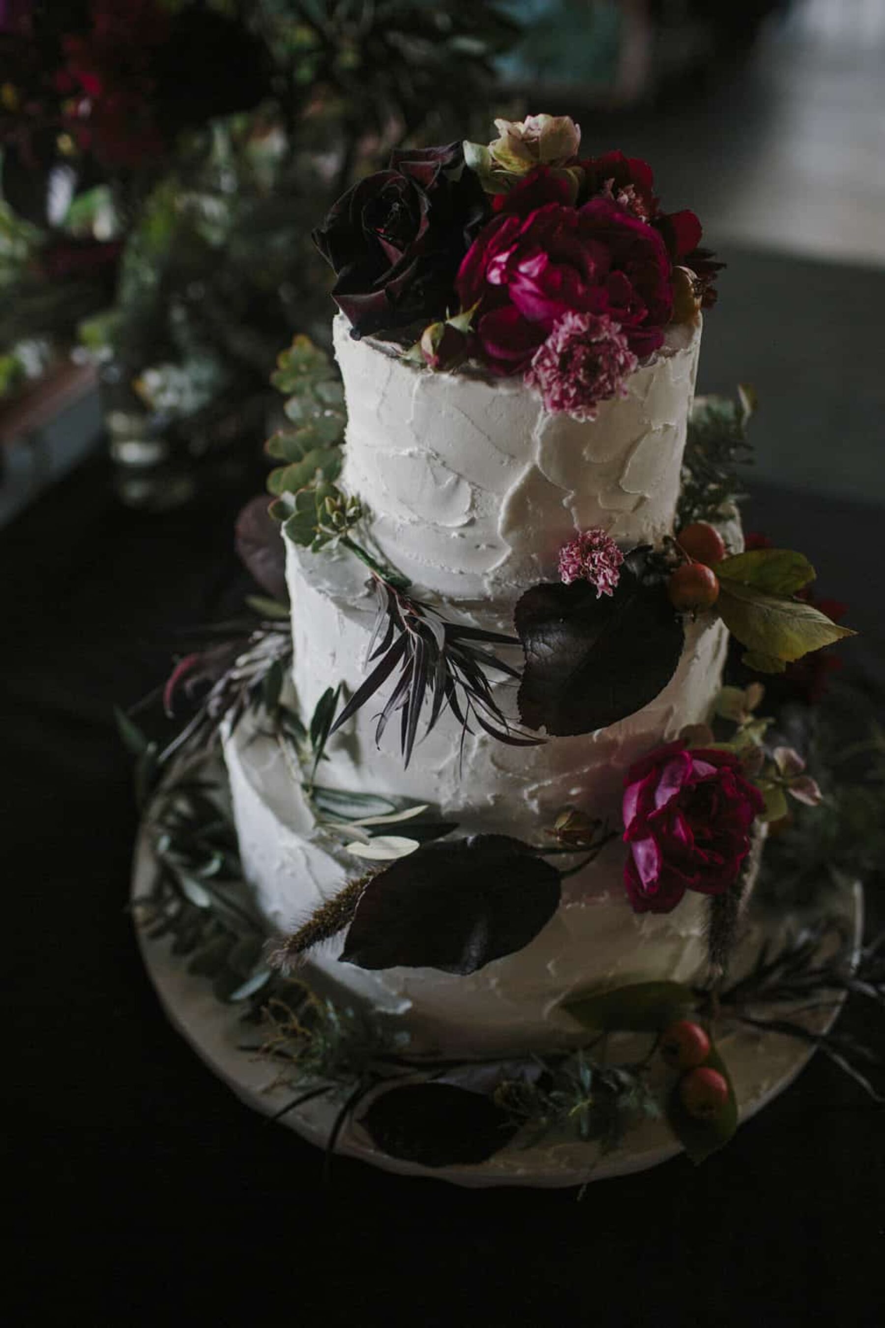 3 tier wedding cake with fresh flowers