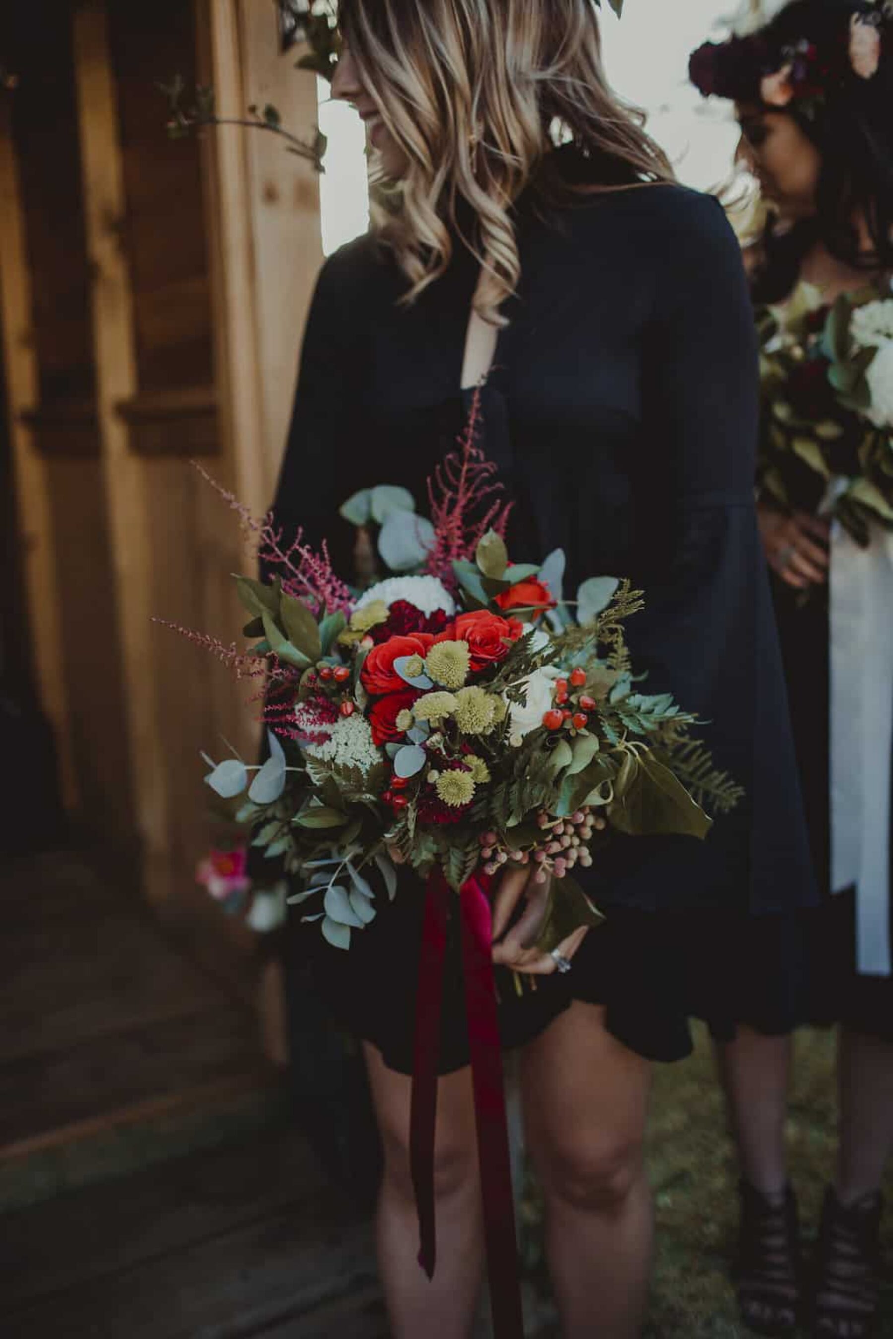red and green bridesmaid bouquet